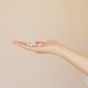 white pills on palm