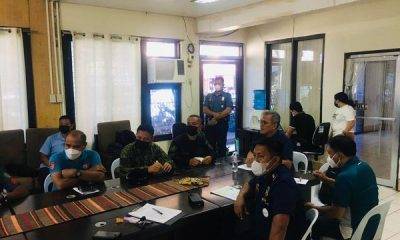 A group of uniformed men having a meeting