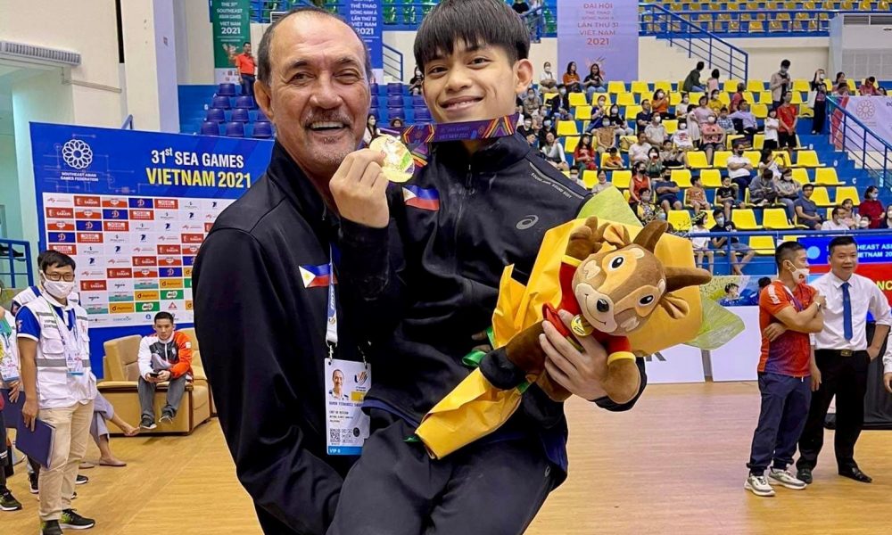 Ramon Fernandez carries Carlos Yulo