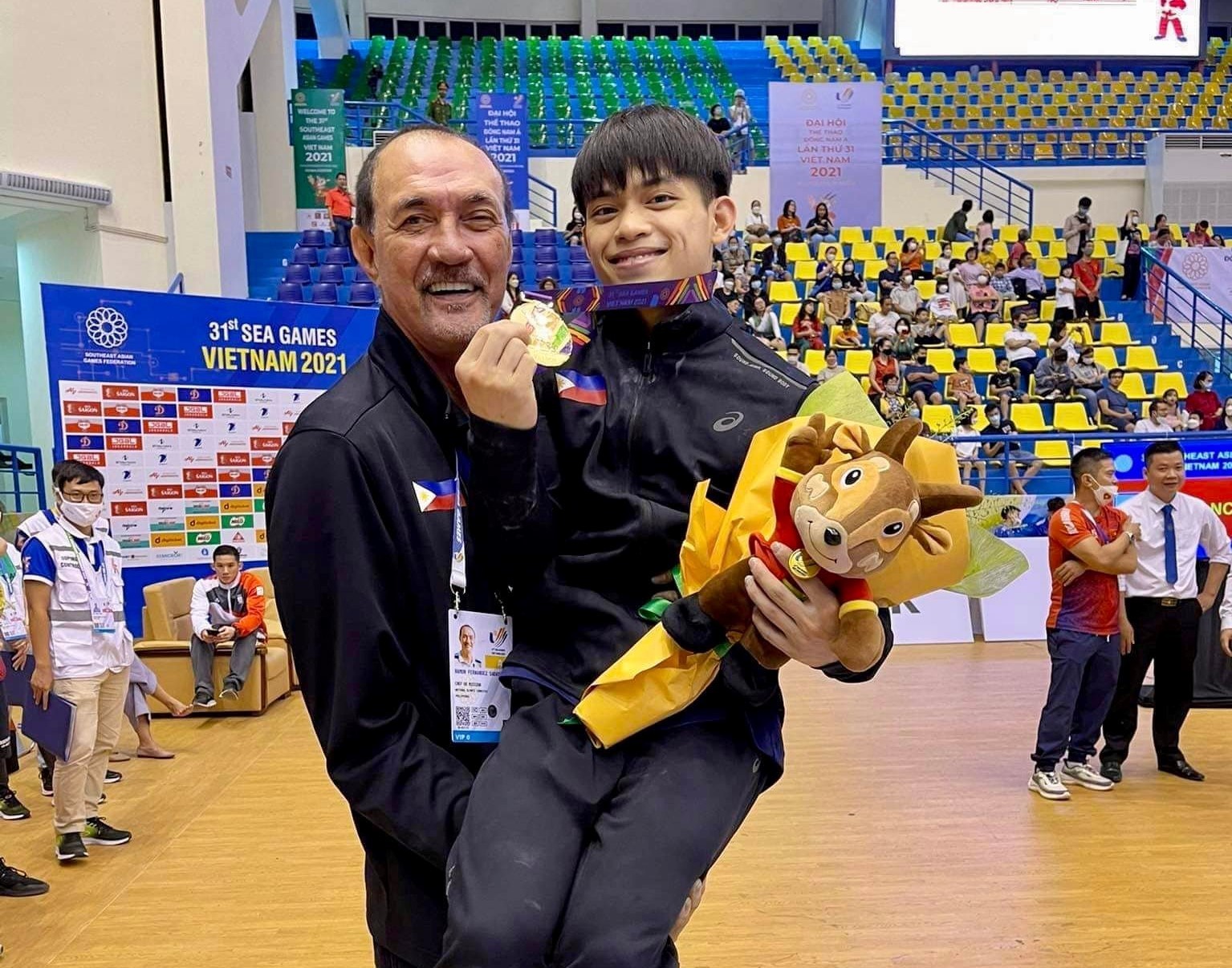 Ramon Fernandez carries Carlos Yulo