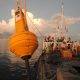 Yellow navigational buoy at sea