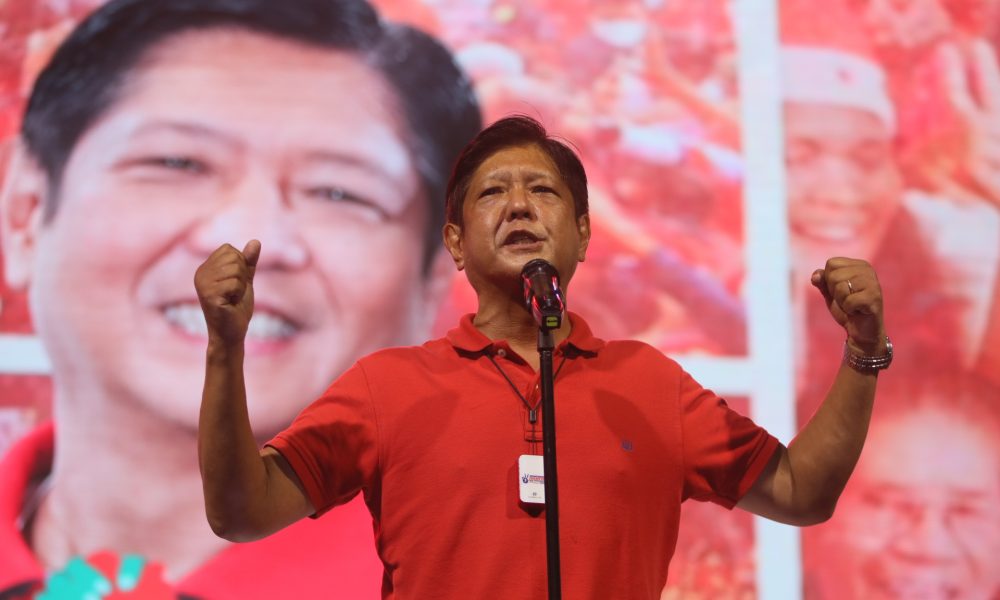 Ferdinand "Bongbong" Marcos wearing red on stage