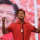 Ferdinand "Bongbong" Marcos wearing red on stage