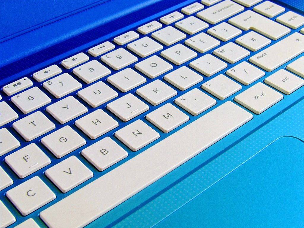 Blue laptop with white keyboard