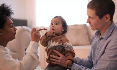 Woman feeding a child