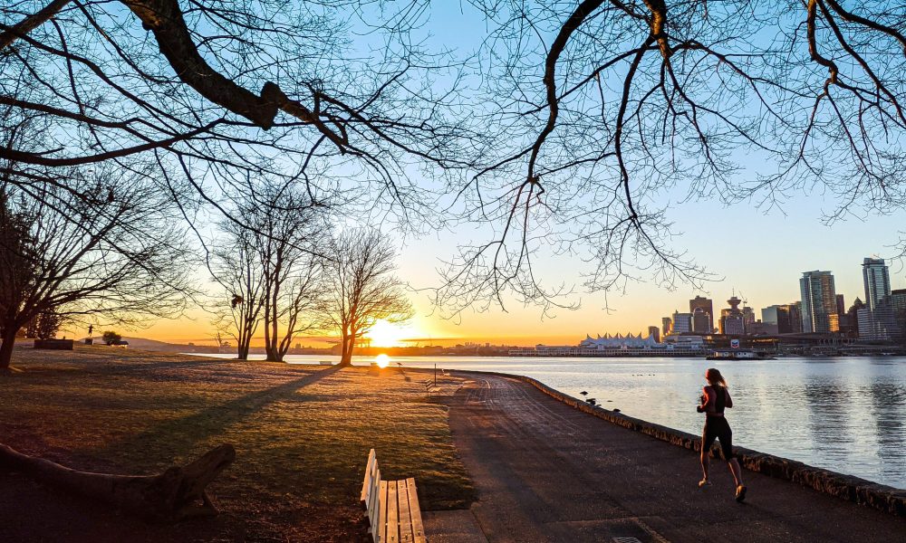 Woman jogging at Stanley Park in Vancouver