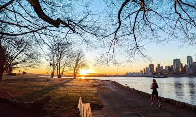 Woman jogging at Stanley Park in Vancouver