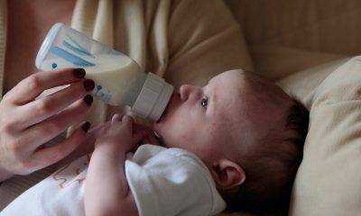 baby drinking milk from bottle