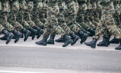 Focus on army boots walking