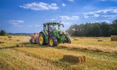 green tractor on brown grass