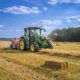 green tractor on brown grass