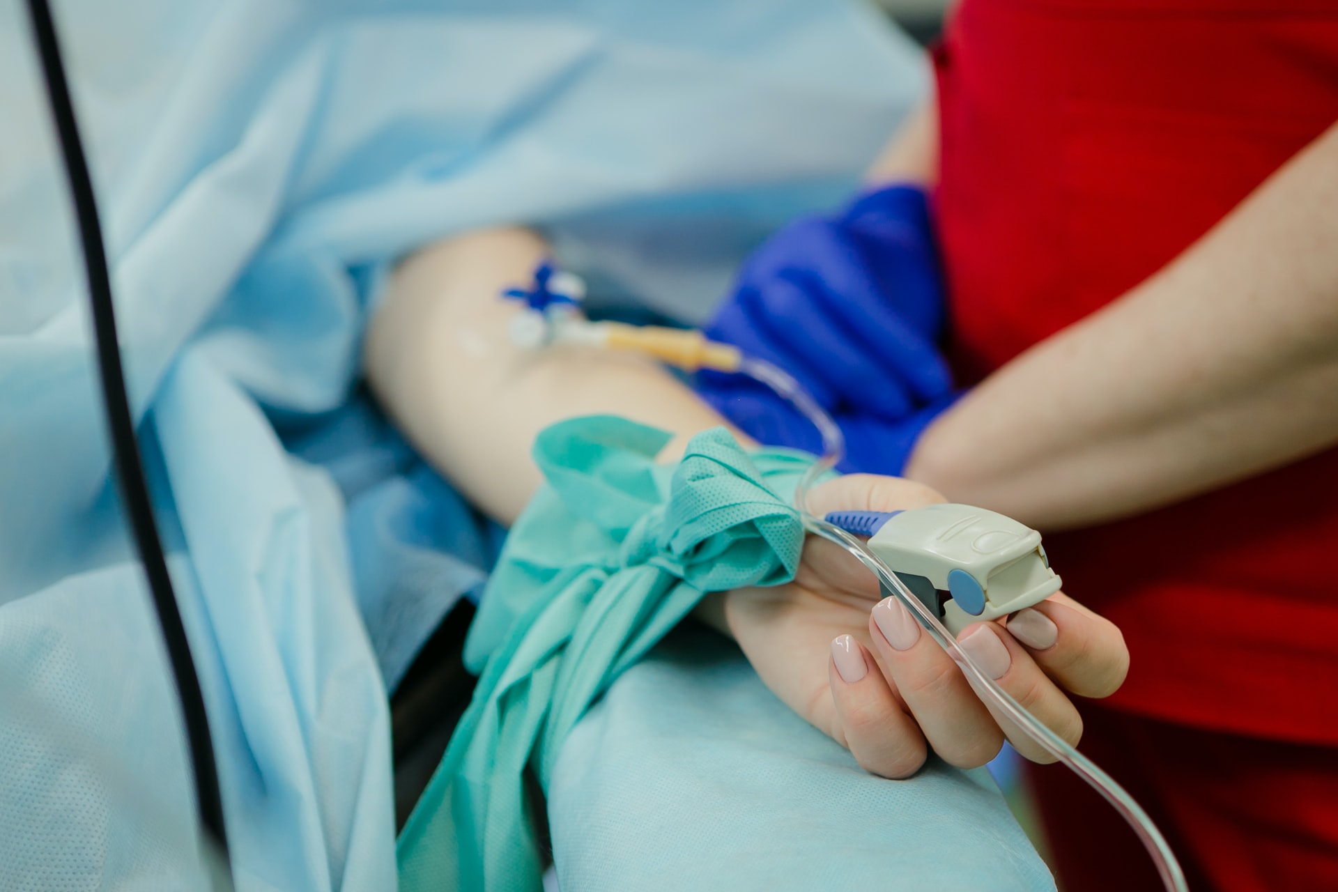 patient's hand with tubes