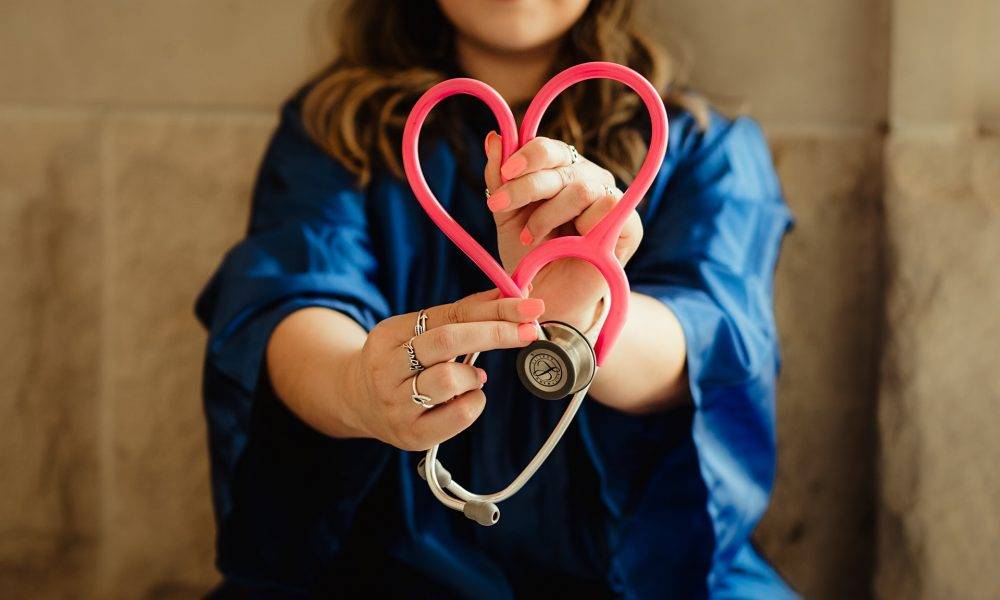 girl in blue holding stethoscope