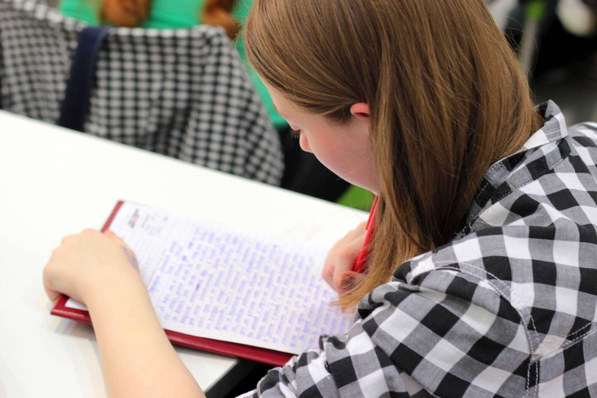 Girl writing on paper