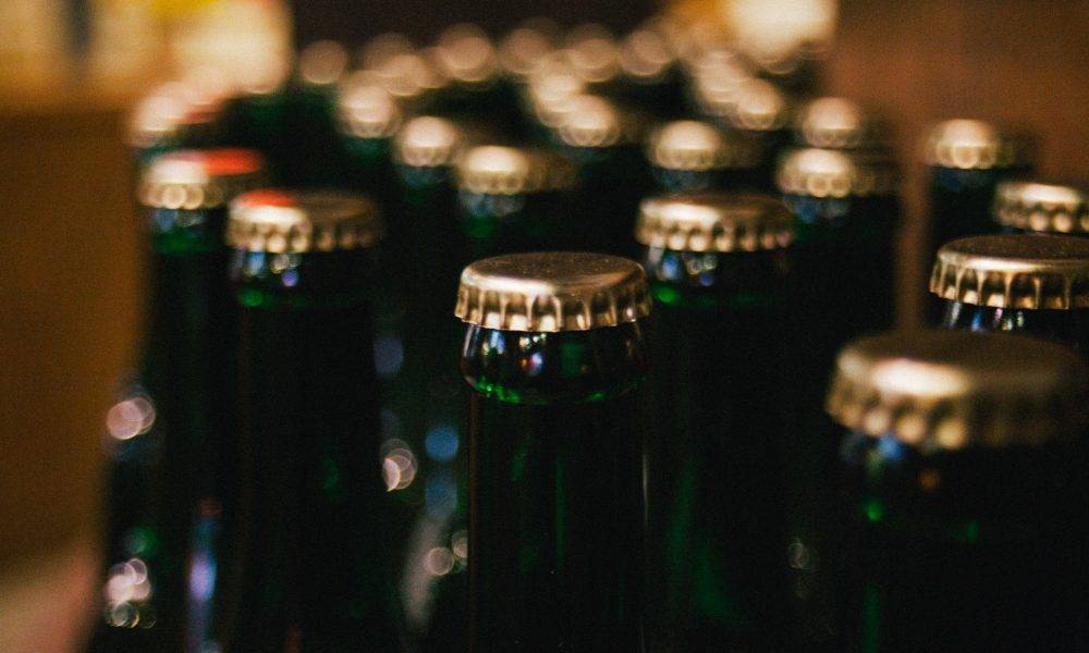 Bottlecaps on green glass bottles
