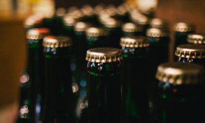 Bottlecaps on green glass bottles