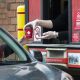 A cup being given in the drivethru service of Tim Hortons