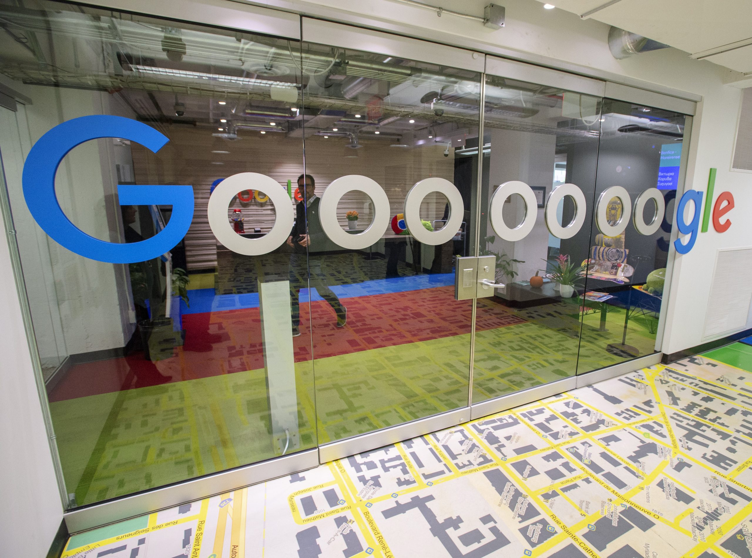 Google office with the glass decorated with the word Gooooooogle