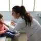 Registered nurse vaccinates a child for polio