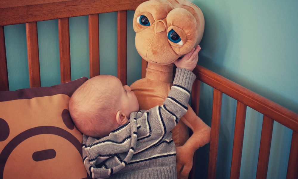 Baby with E.T. stuff toy