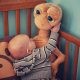 Baby with E.T. stuff toy