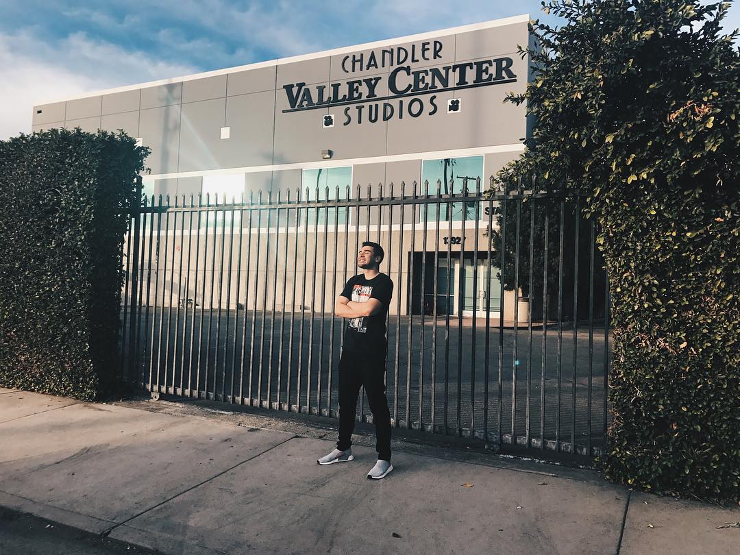 Andre Paras posing in front of Chandler Valley Center Studios