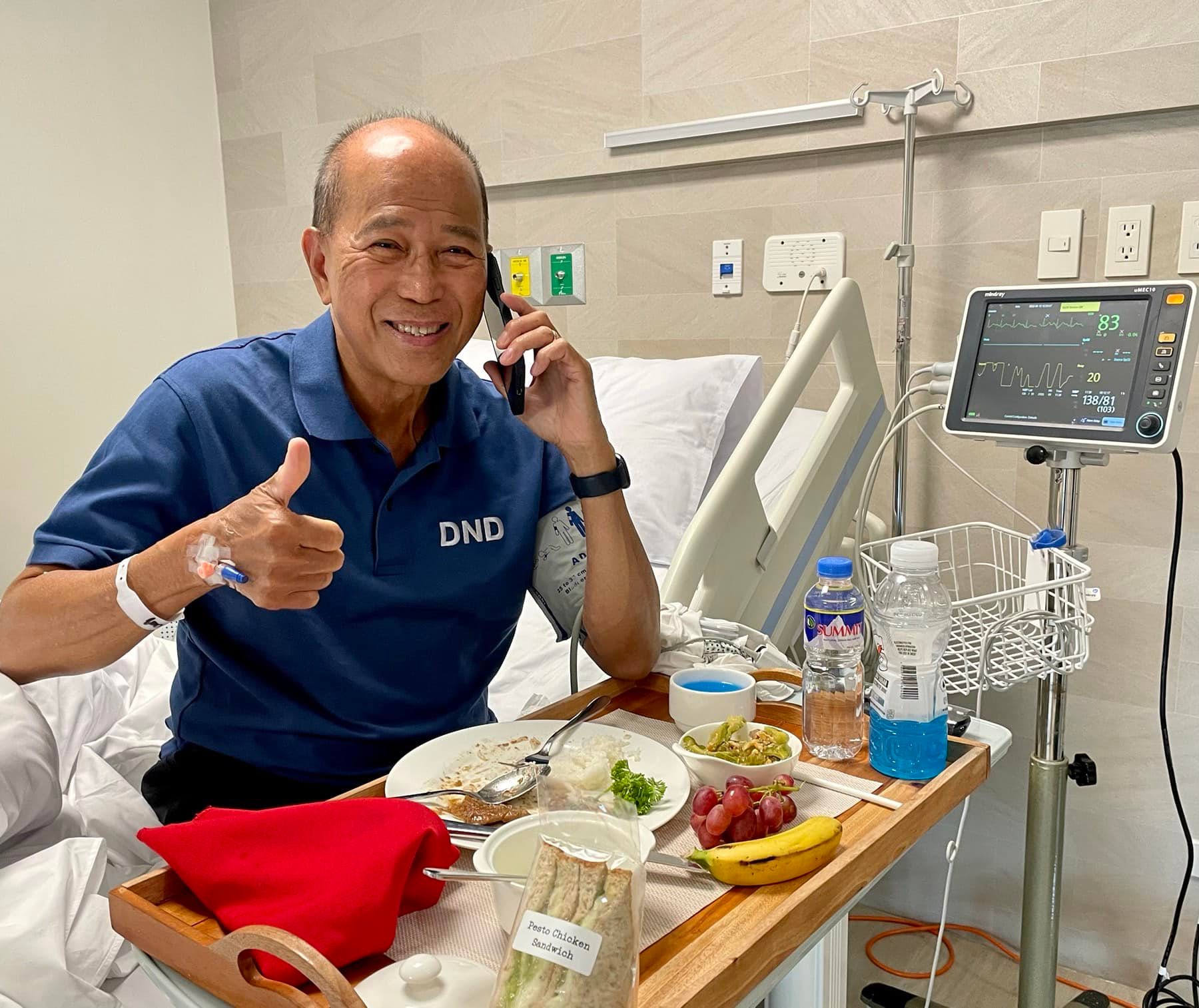 DND Sec Delfin Lorenzana poses while eating breakfast on his hospital bed