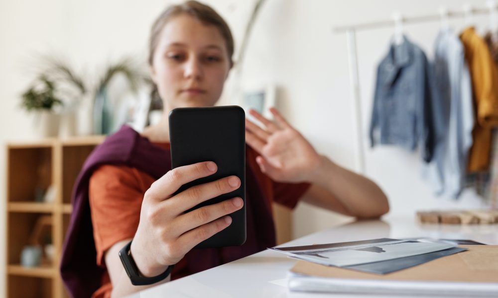 Girl Holding Black Smartphone