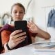 Girl Holding Black Smartphone