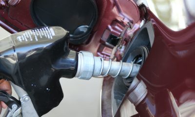 Man filling up gas tank of a car