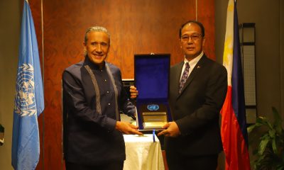 United Nations Resident Coordinator in the Philippines, Gustavo González and Presidential Peace Adviser, Secretary Carlito Galvez Jr. holding a plaque of recognition