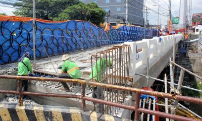 Workers installing steel bars on the Imus toll bridge