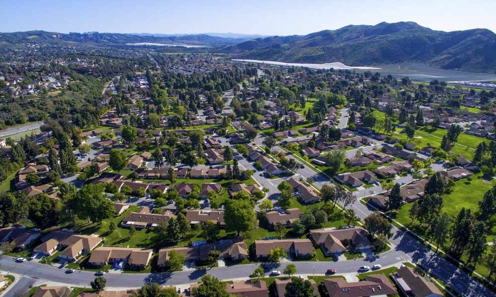 aerial view of houses with green environment