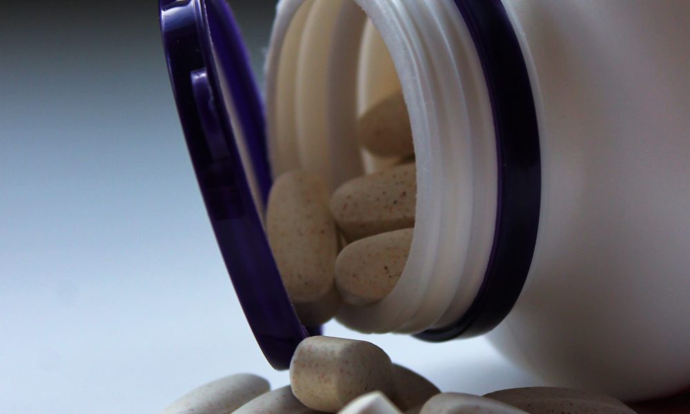 open bottle of pills