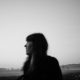 Blurred black and white side profile of a woman