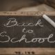Words "Back to school" written with chalk on board