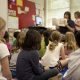 Children listening to a teacher