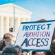 protect abortion access placcard
