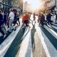 A crowd of people walking on the pedestrian lane