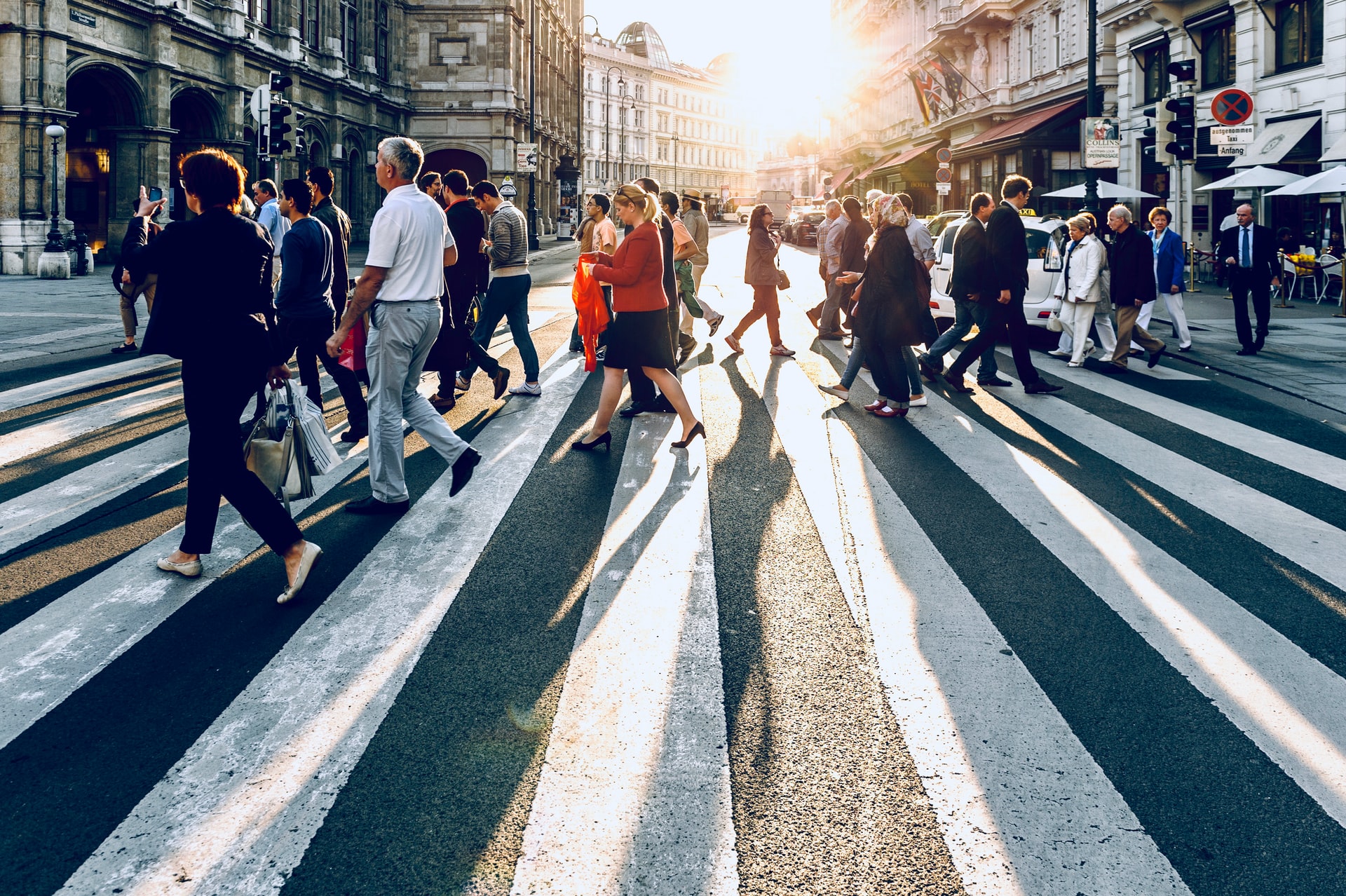 A crowd of people walking on the pedestrian lane
