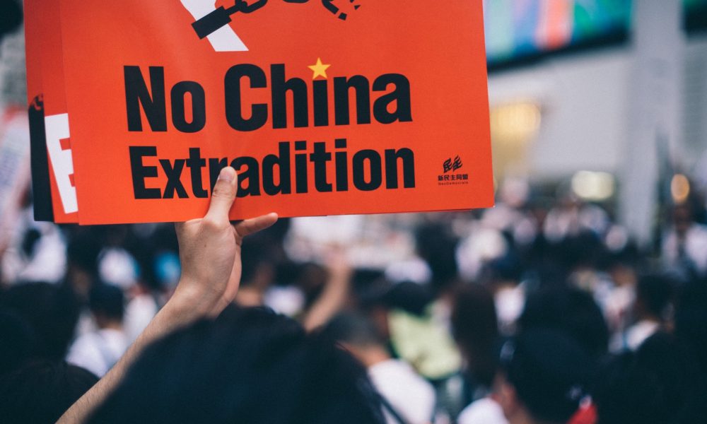 Red placard read as "No China extradition"