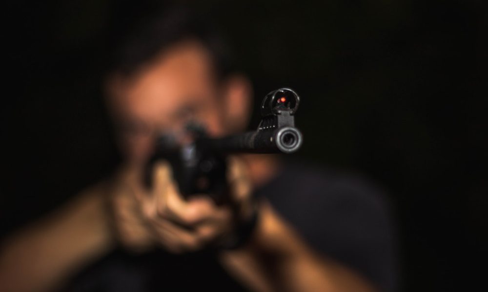 man holding a rifle