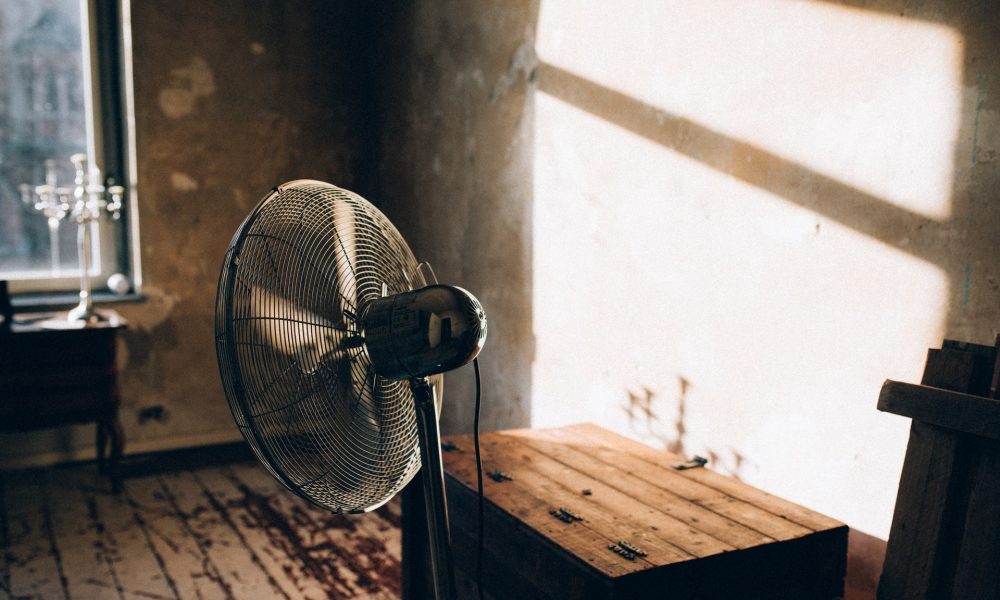 Electric fan in a sun-lit room