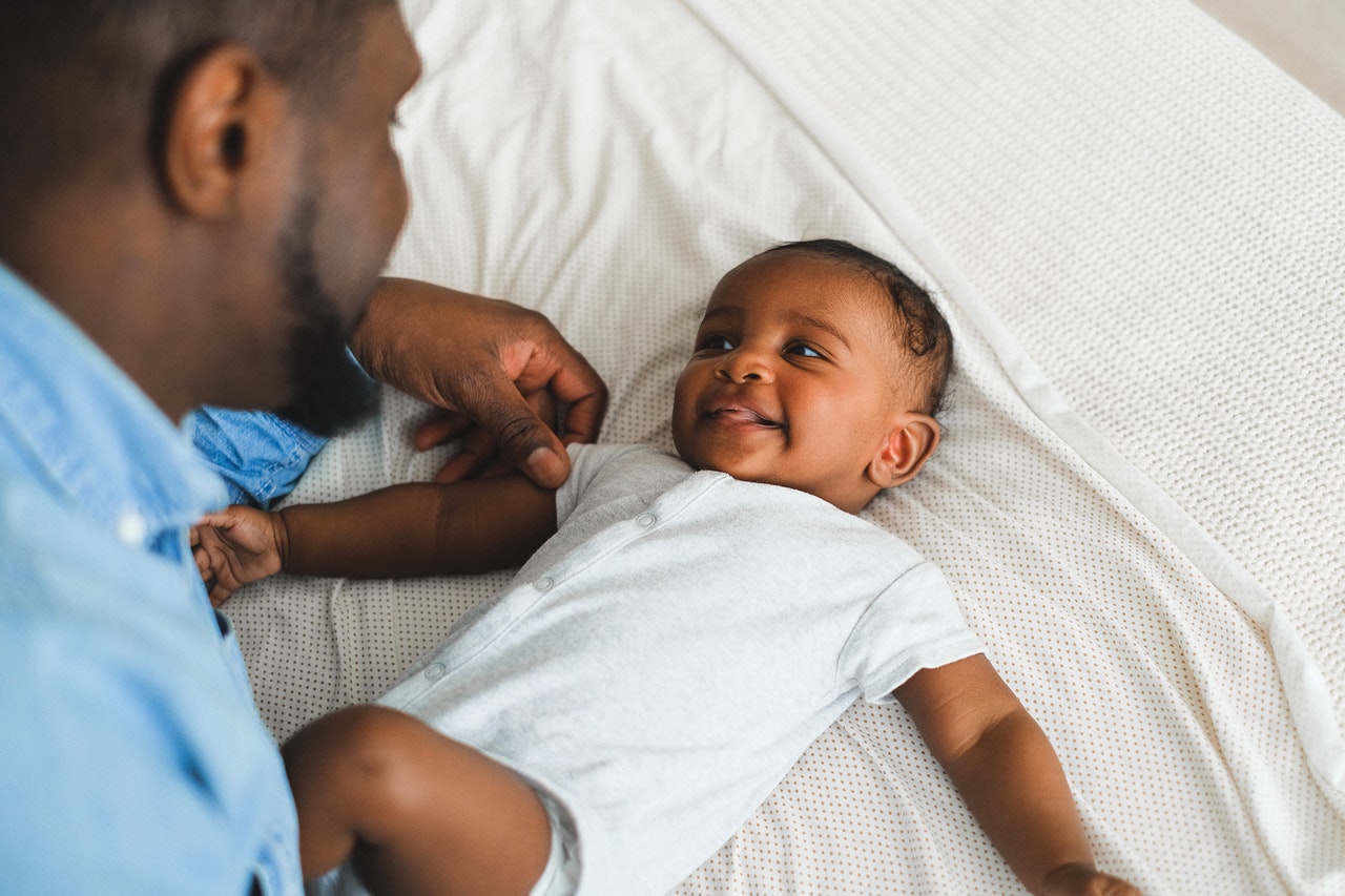 father playing with his baby