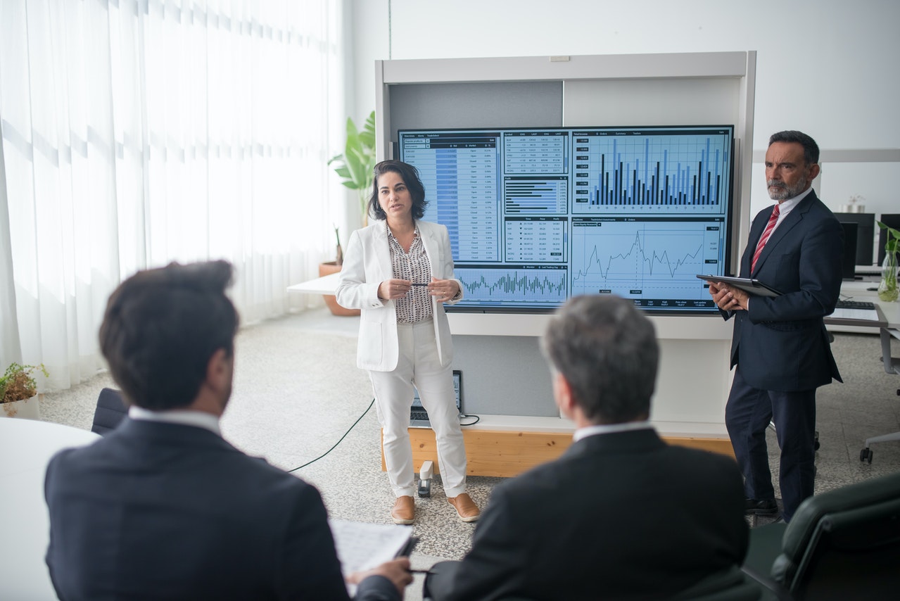 woman presenting in front of guys