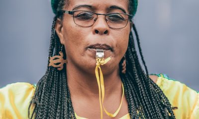 Woman blowing a whistle