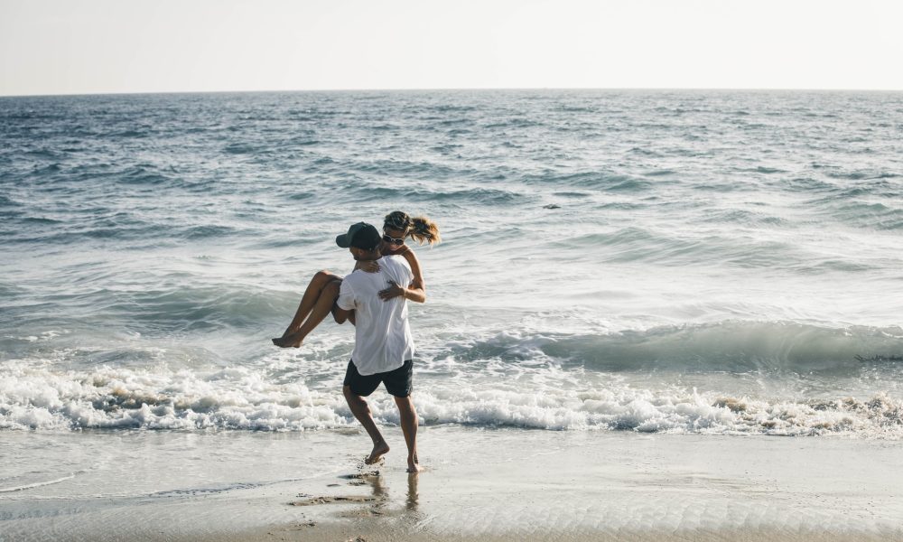 couple playing on the beach