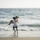 couple playing on the beach