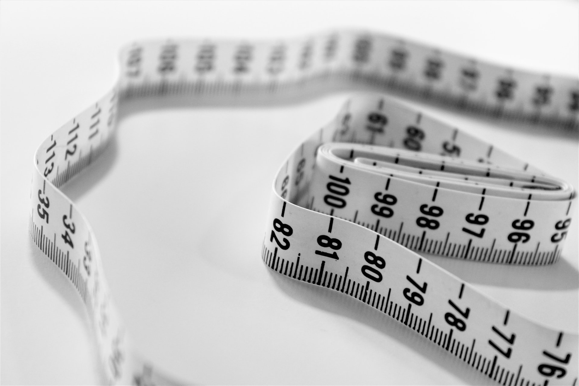 A tape measure on a white surface