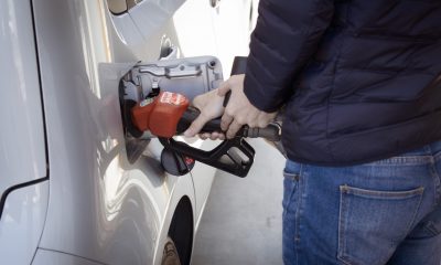 man refilling gas